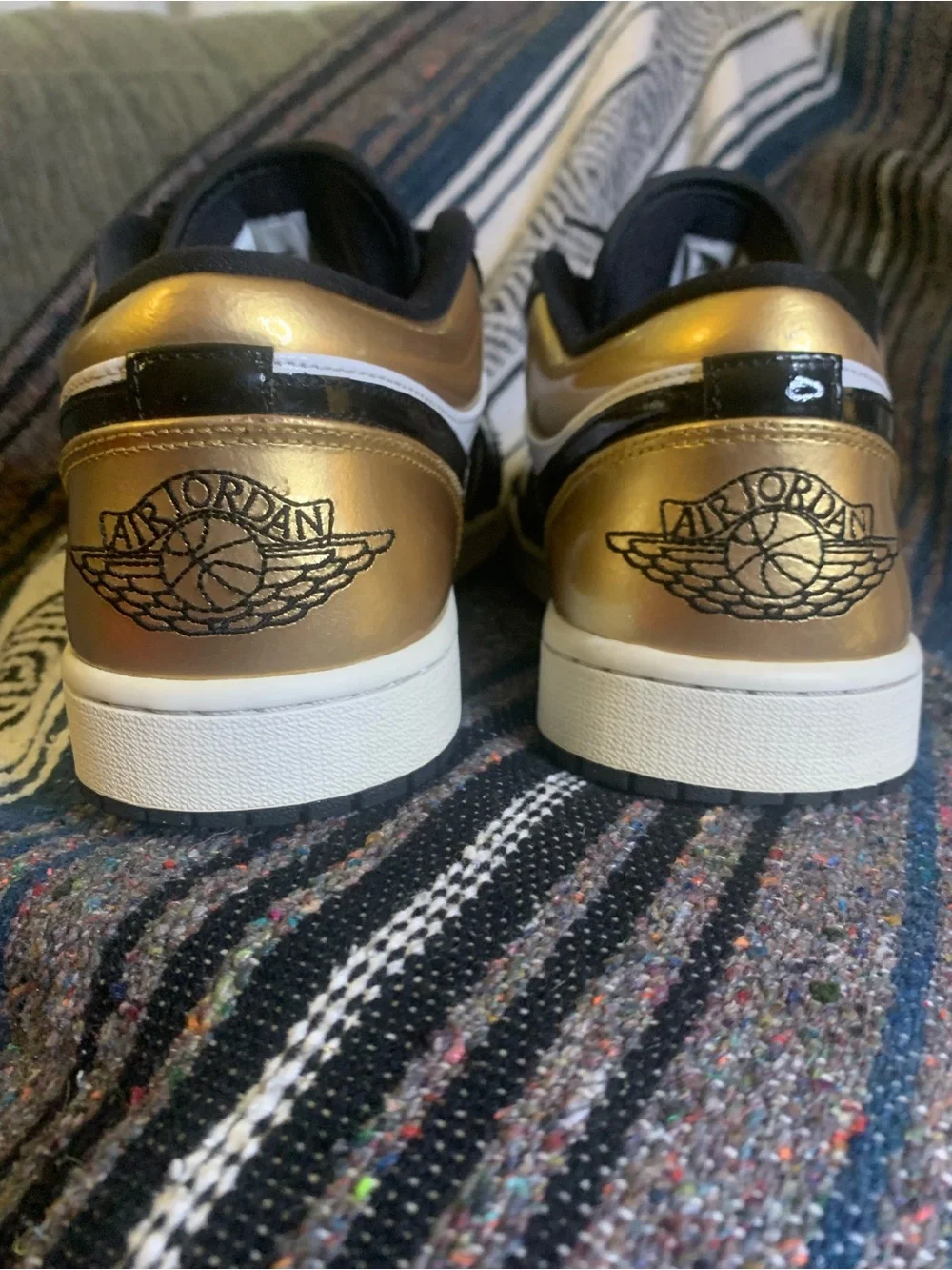 Air Jordan low “Gold Toe” in size 11 men.